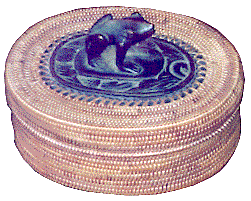 [Oval, rattan basket with carved wooden frog decoration on the lid: 21k]