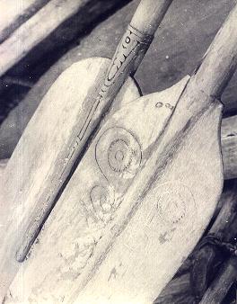 [Trobriand canoe paddles with worn curvilinear design motifs on the blades: 20k]