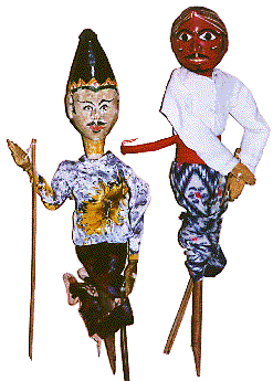 [2 male rod puppets. One has a fierce, bright red face. The other wears a bright flowered shirt: 24k]